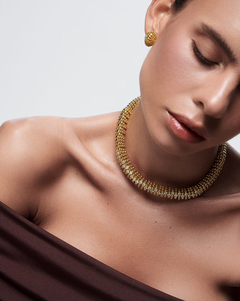 Simple yet powerful gold fashion stud earrings and necklace for daily wear