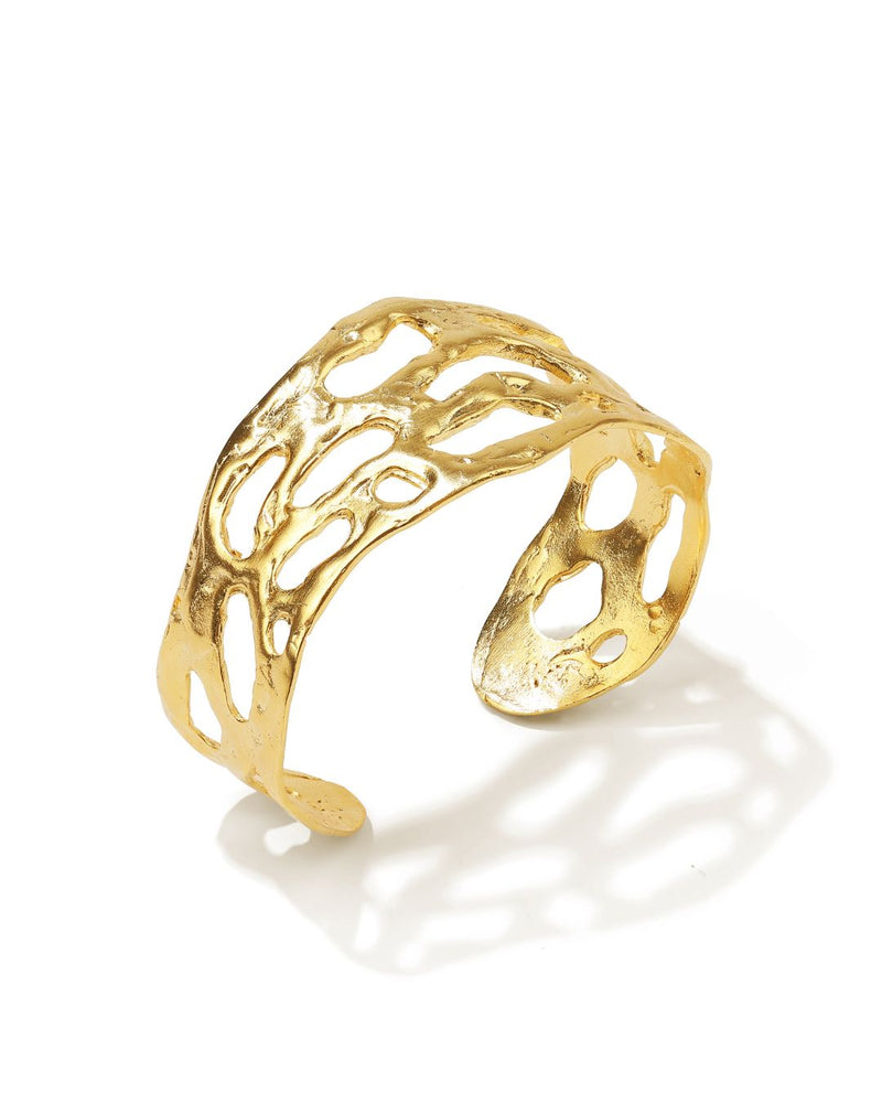 Bold gold cuff bracelet with minimalist embossed detailing