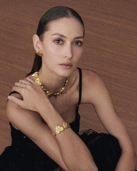 Gold bracelet featuring a playful heart design