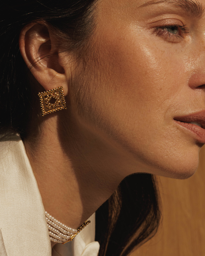 Traditional gold earrings with modern styling