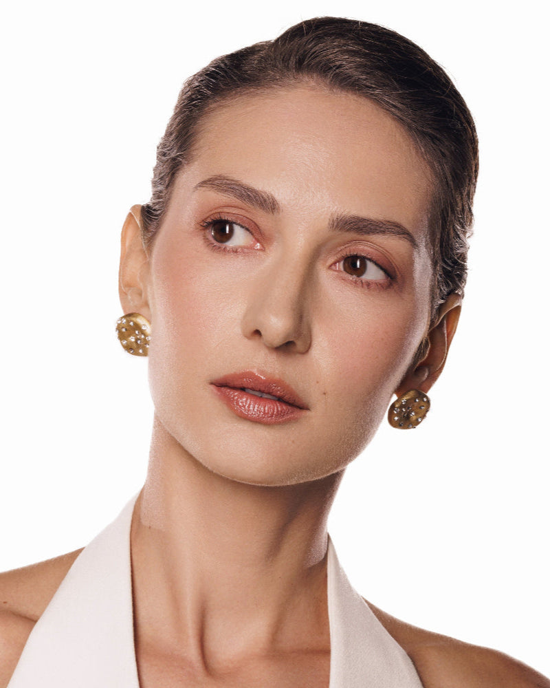 Lightweight brushed gold earrings with modern charm