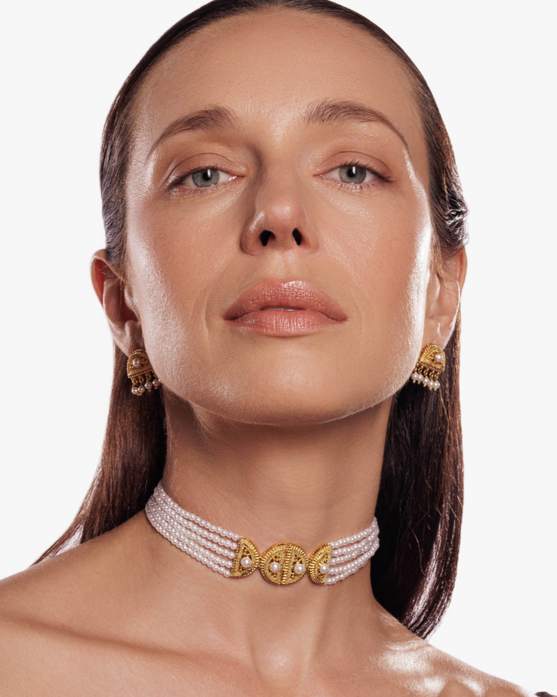 Delicate pearl strand necklace with Indian-inspired pendant