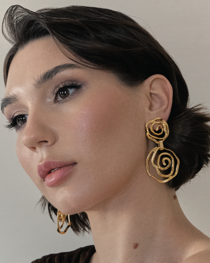 Swirling floral gold earrings for special occasions
