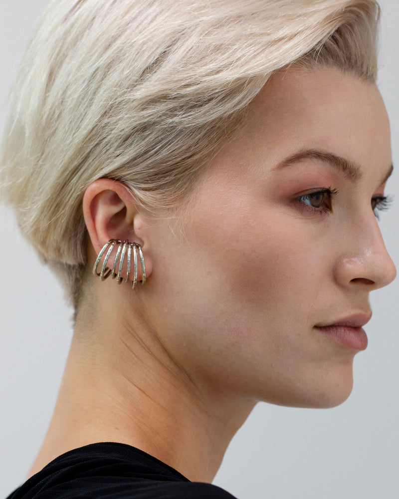 Sculptural silver ear wrap with organic texture