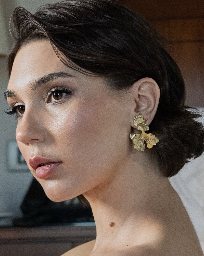 Gold petal earrings with feminine design