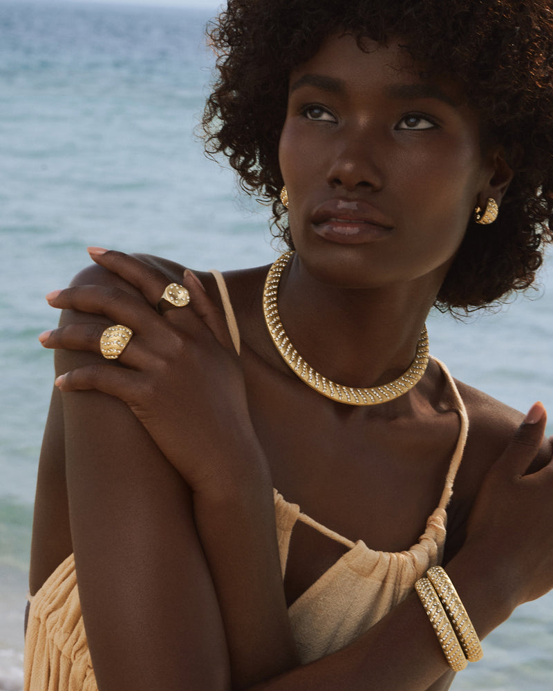 Model stacking Aurora Dust Chunky Ring with slim gold bands for layered style