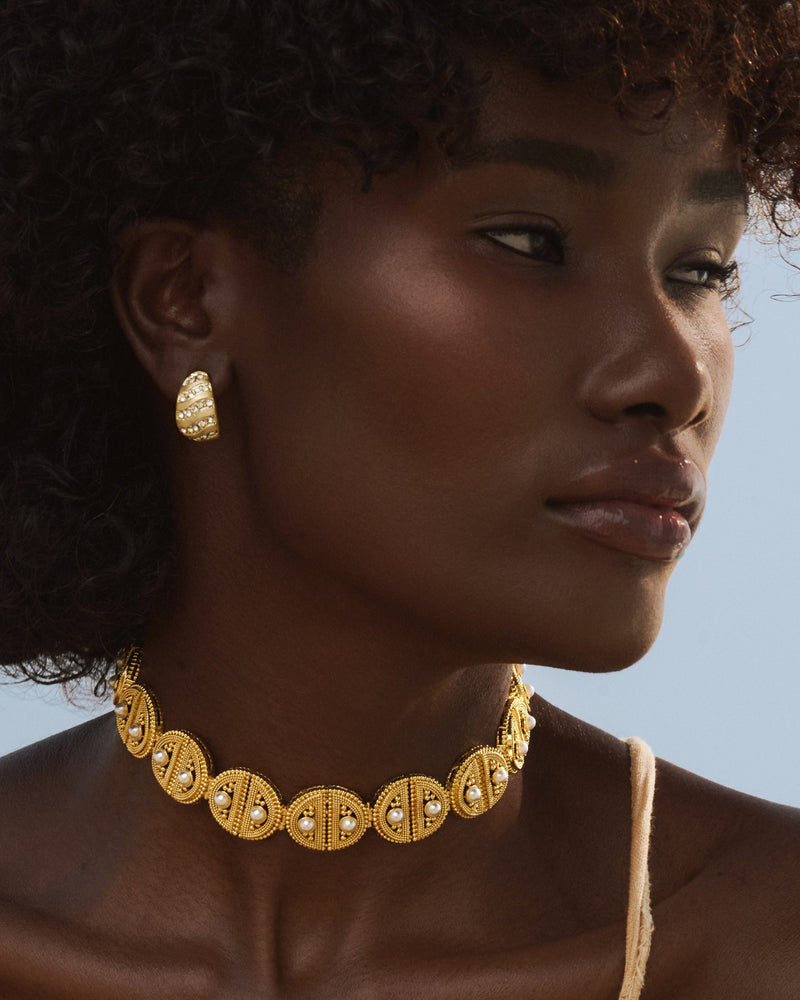 Statement gold choker necklace with pearl accents