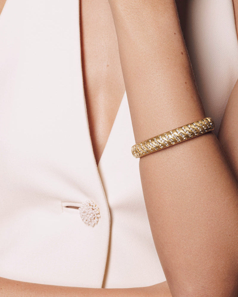 Close-up of vintage-inspired chunky gold bracelet