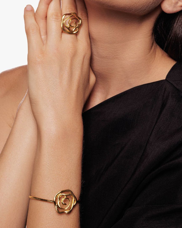 Gold bracelet featuring nature-inspired floral details