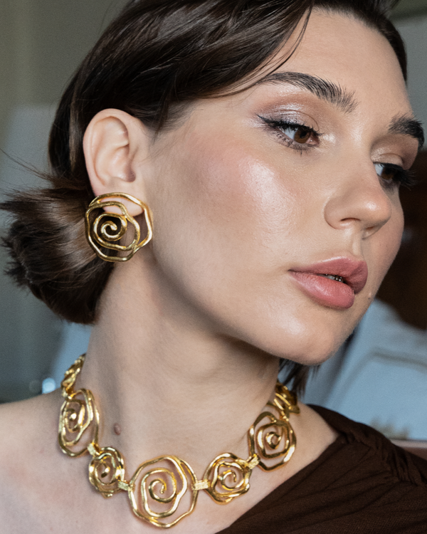 Whimsical floral stud earrings in gold finish