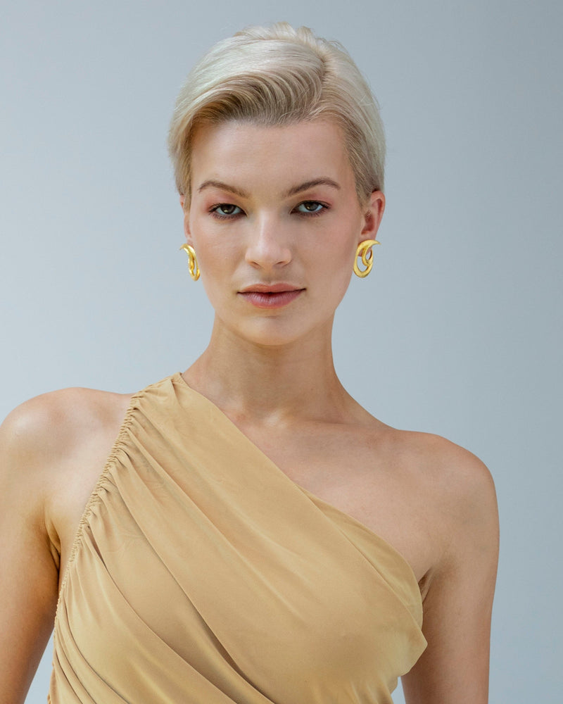 Lightweight gold earrings with organic curves