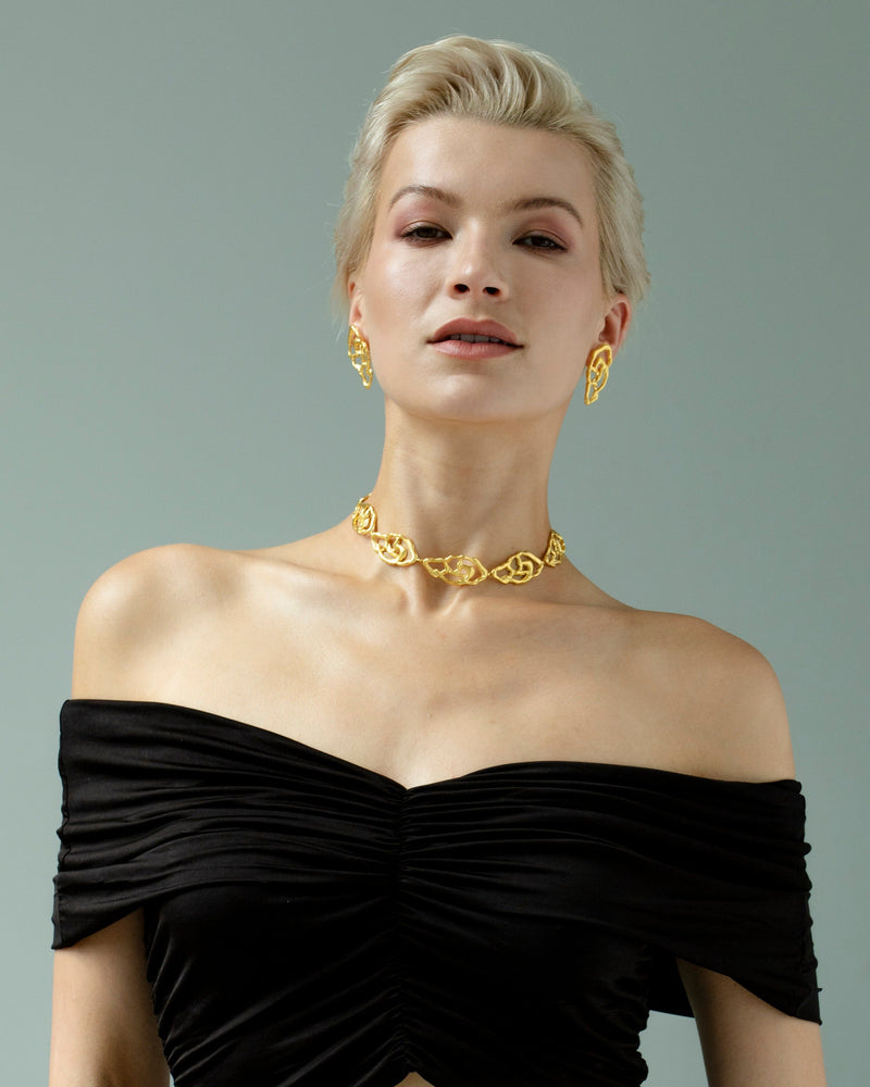 Modern gold earrings with unique artistic silhouette