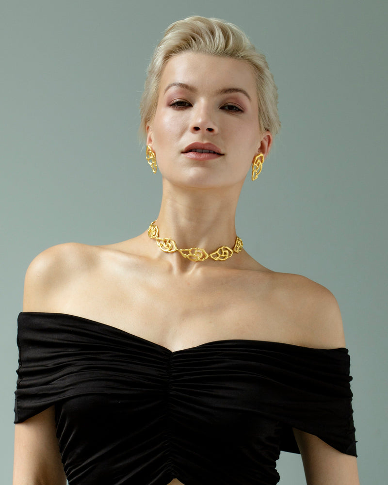 Gold pendant necklace with botanical design