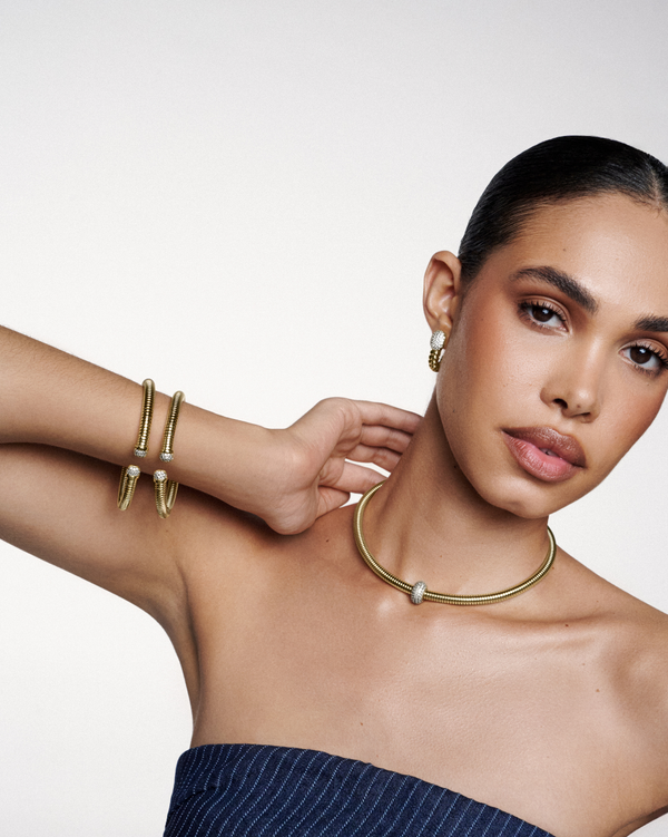 Sculptural serpent-inspired bracelet, earrings, and necklace set