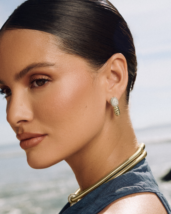 Sculptural gold earrings, serpent-inspired and a timeless piece