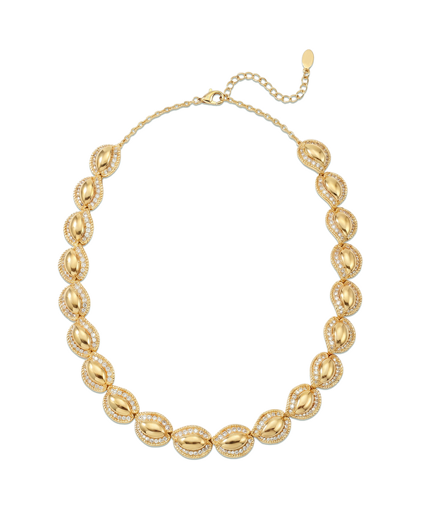 Sculptural statement Gold necklace with leaf-like pendants on a white background