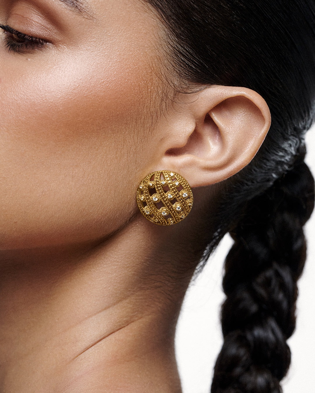 round dome-inspired earrings with zirconia stones.