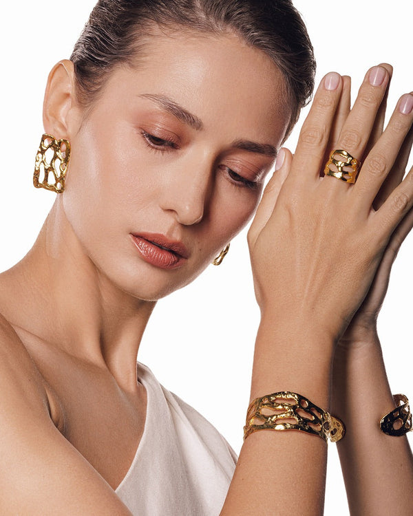 24k gold-plated Mystic Embossed Cuff Bracelet featuring a textured design and adjustable open fit—perfect for stacking or wearing solo for a minimalist, mystical touch.