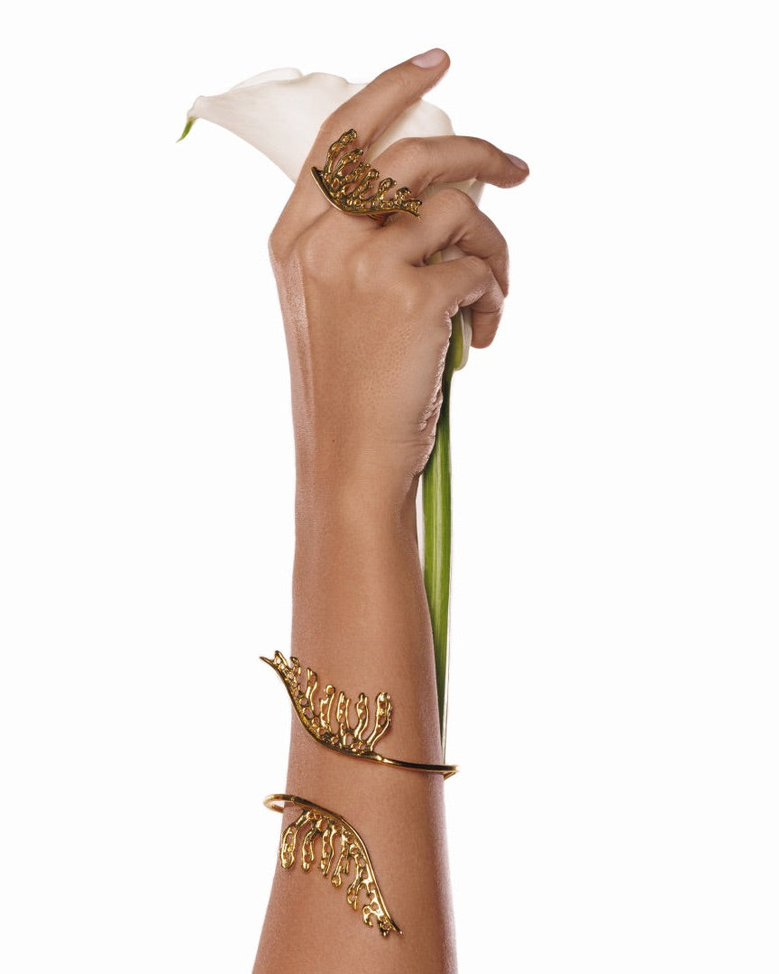 Gold-plated adjustable cuff bracelet with sculpted leaf design, inspired by nature’s elegance and earthy symbolism—ideal for gold jewelry enthusiasts