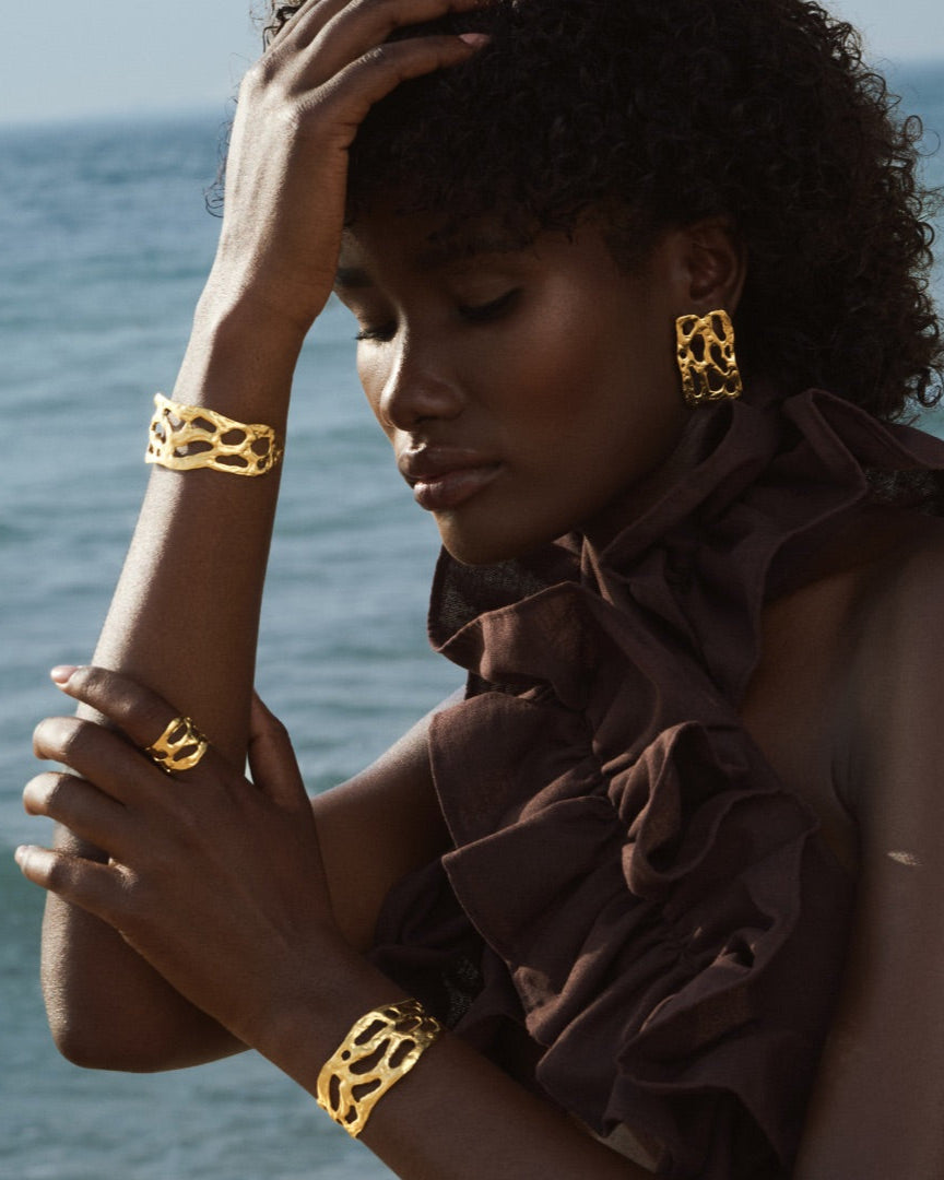 24k gold Mystic Embossed Ring and Bracelet with a minimalist yet bold design – perfect as an adjustable thumb ring or part of a solid gold ring stack.