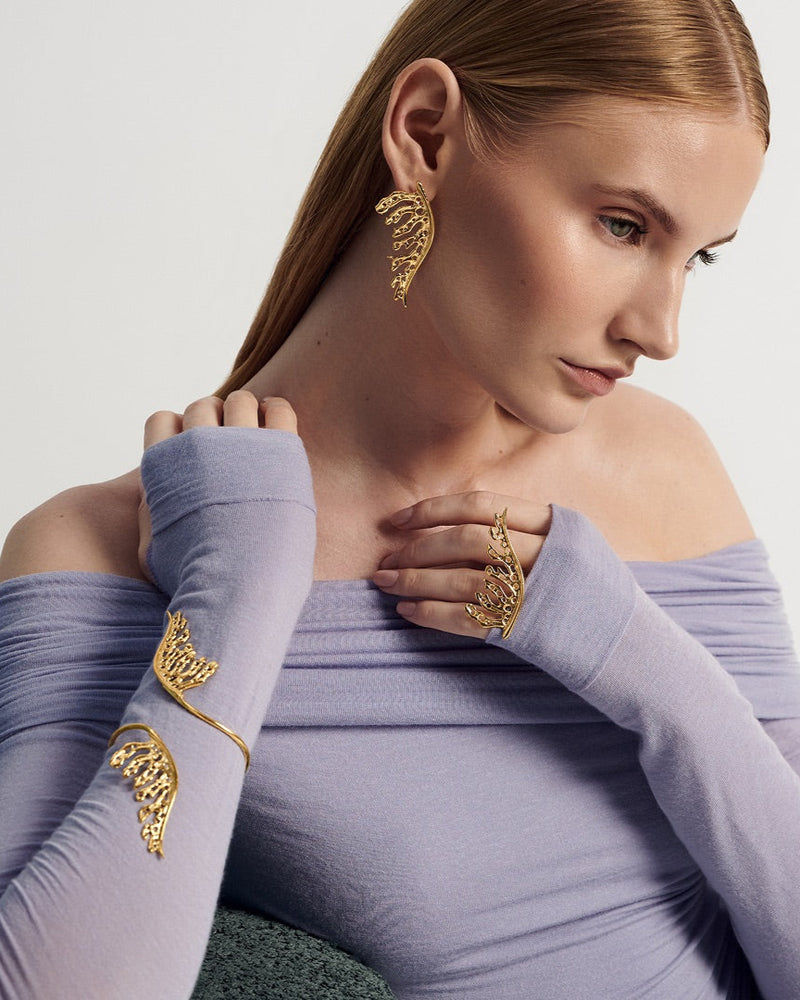 Sculptural 24k gold-plated leaf cuff bracelet, ear cuff and ring with bold, nature-inspired design—perfect for stacking or wearing solo as a statement accessory.