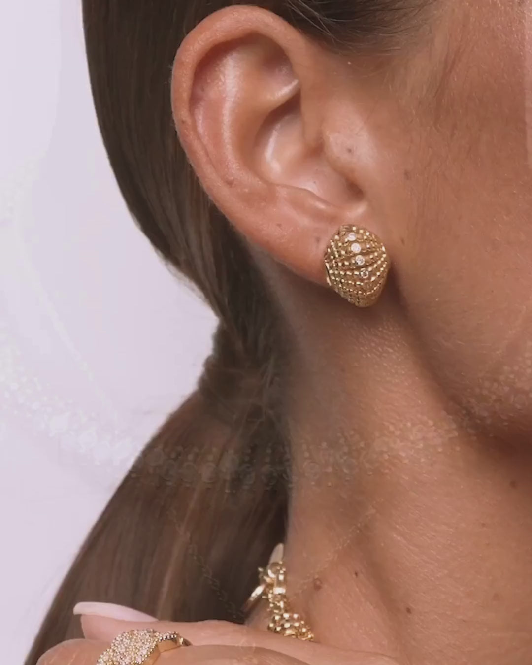 Classic gold-plated stud earrings that radiate confidence