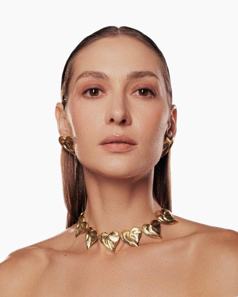 Minimalist gold necklace with heart charms