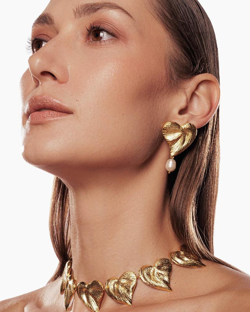 Statement heart-shaped earrings with pearl accent