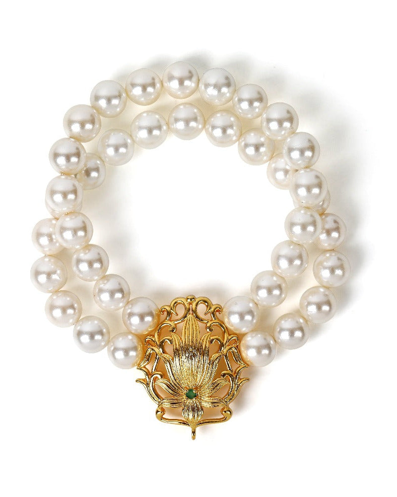 Gold pearl bracelet with lotus charm and colorful gemstones