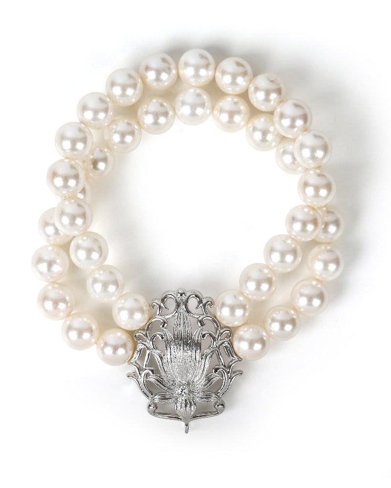 Silver pearl bracelet with lotus charm and zirconia