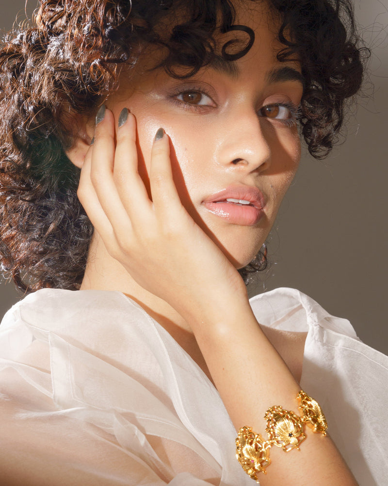 Lotus flower bracelet in gold with multicolored gemstones