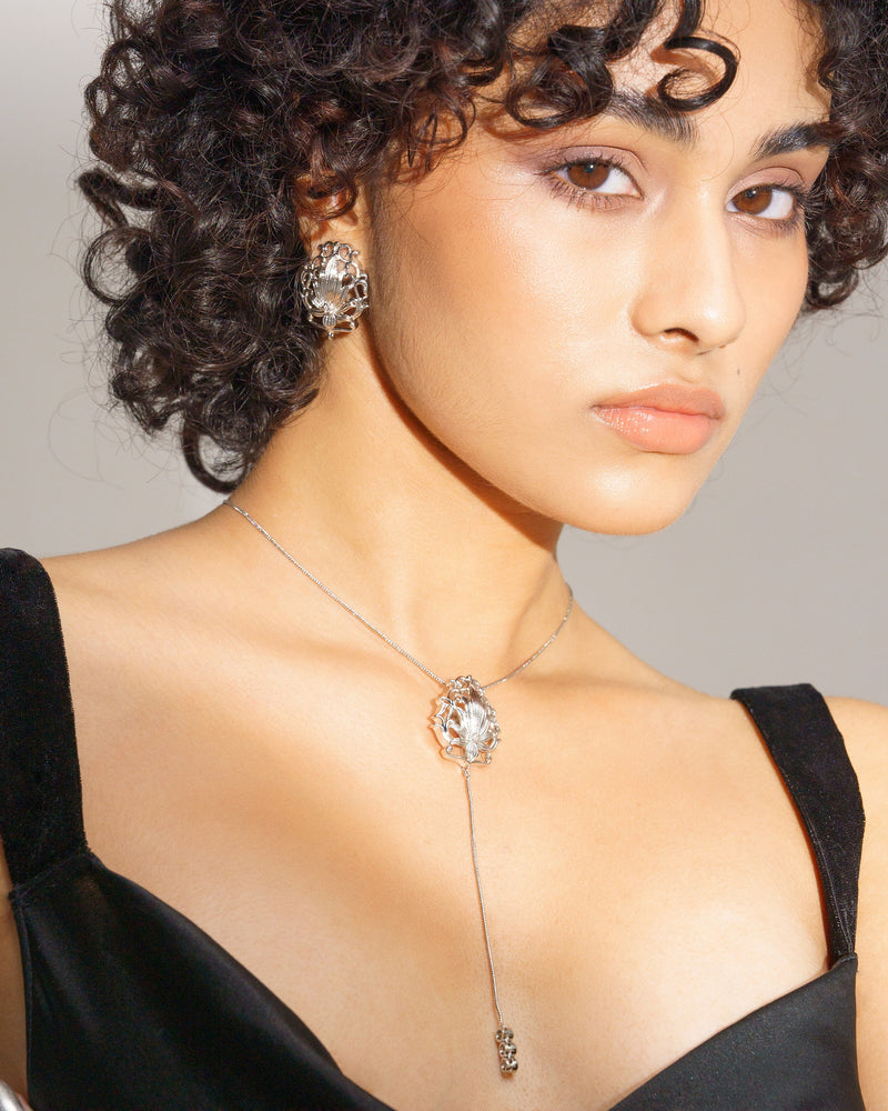 White zirconia lotus earrings in sterling silver